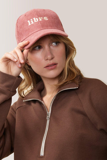 Femme qui porte la casquette Corduroy Libre de Rose Boreal./ Women wearing the Corduroy Libre Ball Cap from Rose Boreal. -Goddess